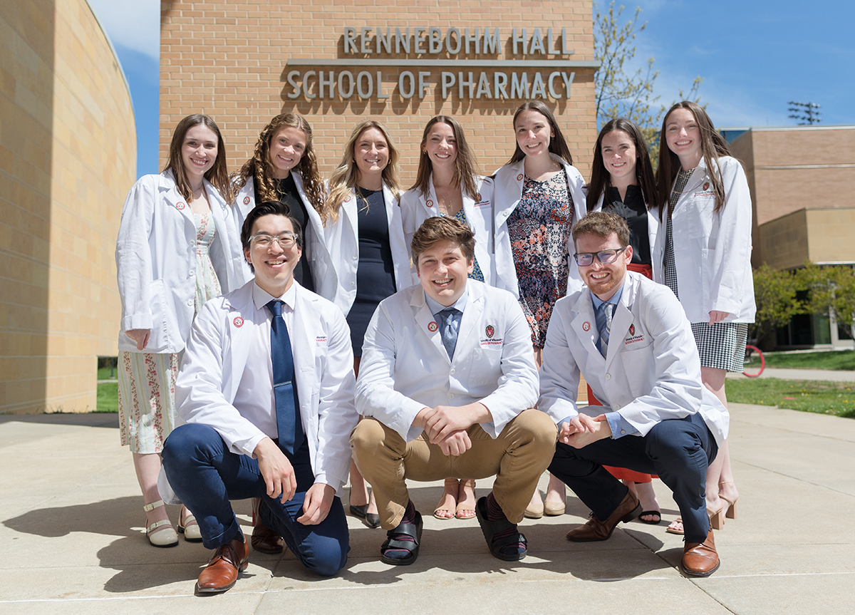 PharmD students pose together following their pinning ceremony.